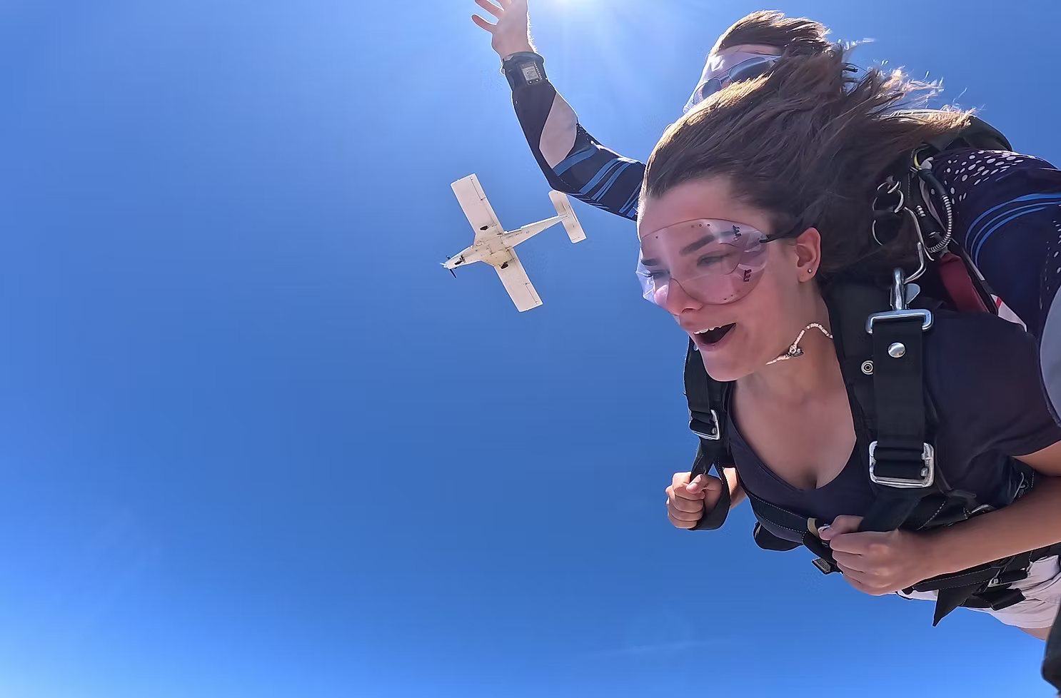 A first-timer beaming as the jump plane peels away above.